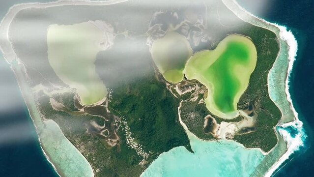 Pacific ocean and island aerial satellite view from space of Maiao, Polynesia. Based on image from Nasa