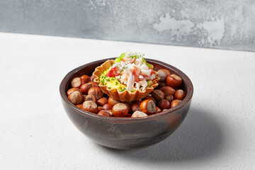 Appetizer with crab meat, edamame beans and creamy sauce. Fine dining: Tartlet with crab. Seafood appetizers in modern dishware. Delicious starters from innovative chef recipes.