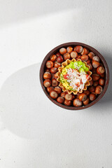 Appetizer with crab meat, edamame beans and creamy sauce. Fine dining: Tartlet with crab. Seafood appetizers in modern dishware. Delicious starters from innovative chef recipes.