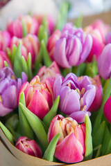 Bouquet of peony tulips in craft paper