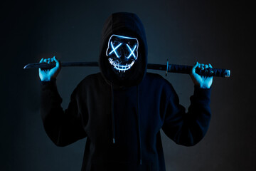 Anonymous with a sword in hand. Dangerous hacker. Internet, cyber crime, cyber attack, system,...