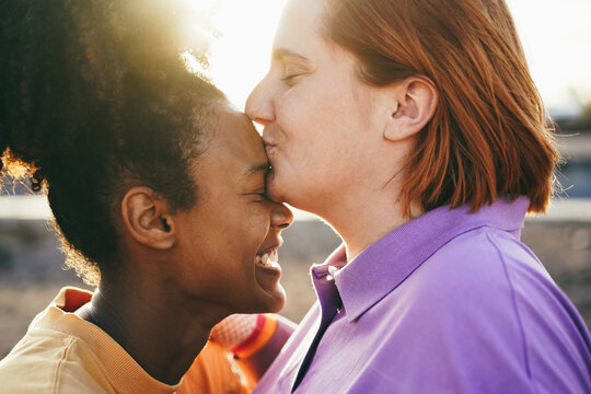 Happy women gay couple having tender moments outdoor - Lgbt and love concept