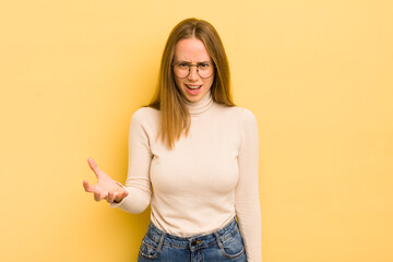 pretty caucasian woman looking angry, annoyed and frustrated screaming wtf or what’s wrong with...