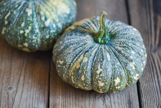green pumpkin food on wooden background, fresh Asian Thai pumpkin frome the garden for cooked food or dessert