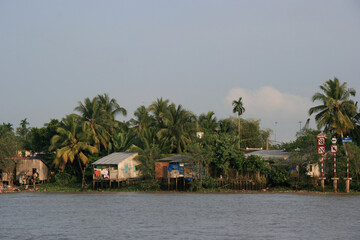 village and slum along a river in the mekong delta in south vietnam 