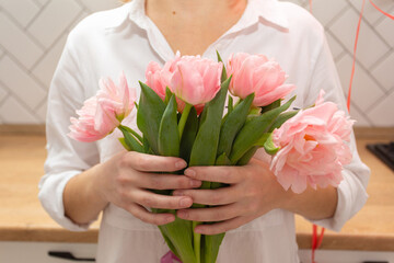 Girl holding pink tulips , bouquet of tulips, pink tulips, close-up