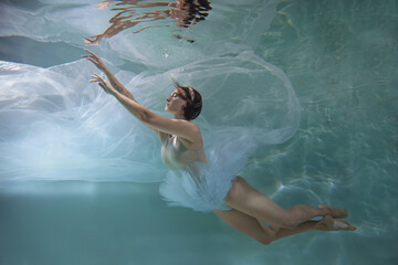 Sensual ballerina underwater, weightlessness and freedom