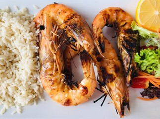 Grilled prawns or shrimps with rice and salad