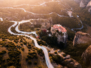 Aerial view of Monastery of Varlaam on top of a sheer cliff. The miracle of Meteora - harmony of man and nature in Greece. A popular travel and pilgrimage destination