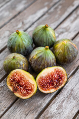 Healthy Organic Green Figs. Top view. Wooden background