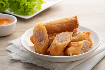 Deep fried spring roll with glass noodles on a white plate.Chinese Traditional