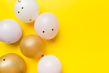 Background with fastive air balloons of round shape and confetti, multicoloured top view. Birthday party background