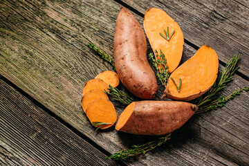 Louisiana Beauregard Sweet Potatoes, Organic orange sweet potato or batatas. vegan food ingredient. banner, menu, recipe place for text, top view