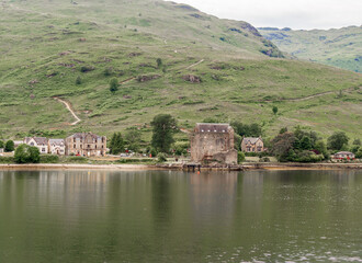 Fototapeta na wymiar Carrick castle as seen from Loch Long, Scotland, UK