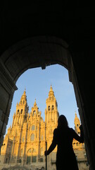 Pilgrim infront of the basilic in Santiago de Comostela on his last steps of his pilgrim way 
