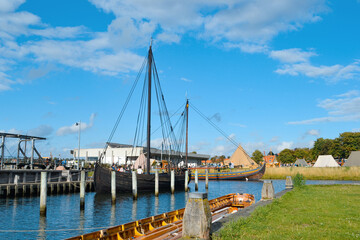 Boat and ships in the Roskilde harbor, Denmark. Sunny day on a summer vacation.