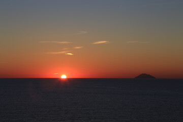 Sunset over the Mediterranean sea with clear sky. Sun over the water