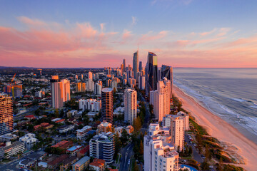 Aerial sunset views looking over Surfers Paradise streets and skyline