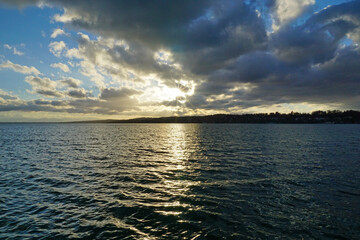 sundown with clouds on lake starnberg bavaria near munich