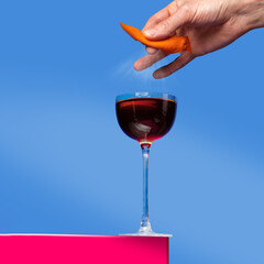 cocktail minimalism. cocktail on a colored background. cocktail in hand