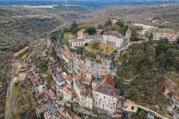 Aerial view of an ancient french village and its castle on cliff, Rocamadour at dusk