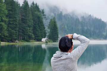 Photographer on Lake Dobbiaco - Dolomites, Italy