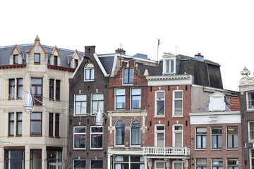 Fototapeta premium Amsterdam Damrak Street Historic Brick House Facades, Netherlands