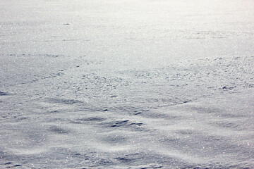 The Snow close-up. Snowdrifts close-up. White snow on the surface. Winter.