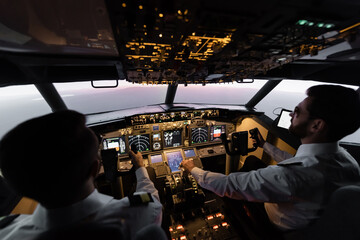 high angle view of professionals piloting airplane in evening during sunset.