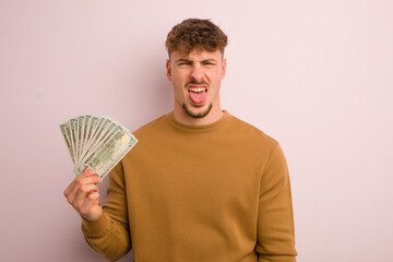 young cool man feeling disgusted and irritated and tongue out. dollar banknotes concept