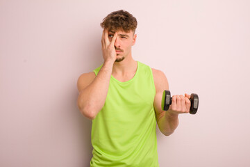 young cool man feeling bored, frustrated and sleepy after a tiresome. fitness concept