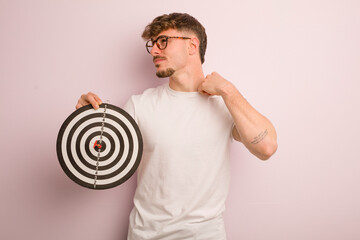 young cool man feeling stressed, anxious, tired and frustrated. dart target concept