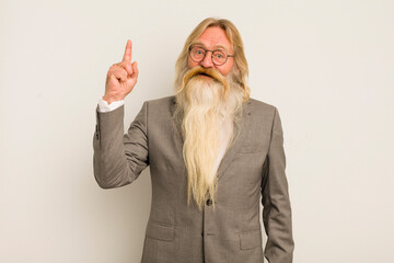 cool senior man feeling like a happy and excited genius after realizing an idea. crazy teacher...