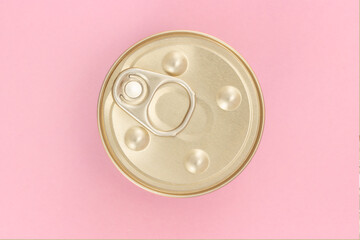 Closed shiny canned food jar with opening ring on top isolated on pink background. View from above