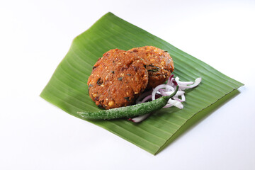 Dal Vada Parippu Vada or Paruppu Vadai Kerala fried snacks savory food on banana leaf Kerala tea...