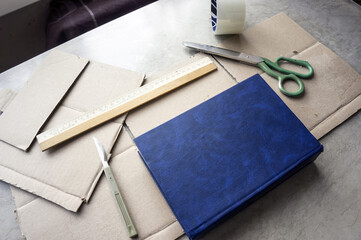 Packing the book in a cardboard box at home before shipping by transport