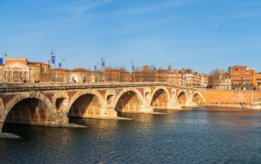 Pont Neuf and boulevard du Maréchal Juin along the Garonne river in winter, in Toulouse in Occitanie, France