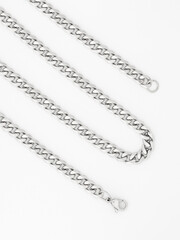 Men's silver chain on a white background with standard links