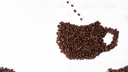 a cup of fragrant coffee from beans lies on a white background for text