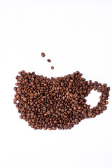 a cup of fragrant coffee from beans lies on a white background for text