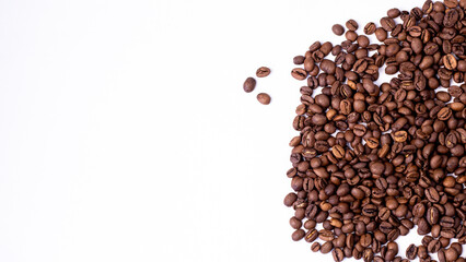 medium rare brown arabica coffee beans lie on a white background for text