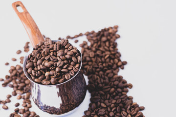 fragrant beans from the coffee tree in medium roast lie on a white background with a place for text