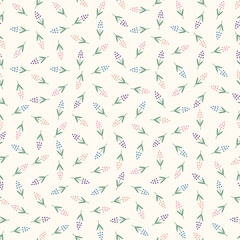 Seamless tossed pattern of multicoloured abstract polka dot flowers on a cream background.
