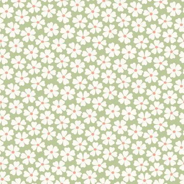 Seamless pattern of abstract white flowers on a green background.