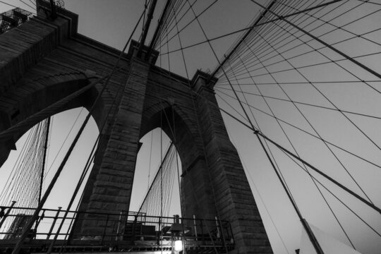 Beautiful black and white bridge photo in NYC, looking up at bridge wires