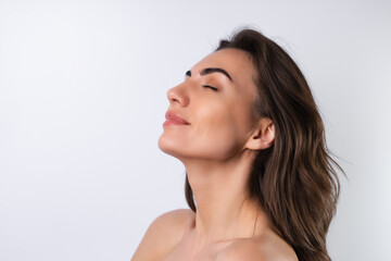 Close-up beauty portrait of a topless woman with perfect skin and natural make-up