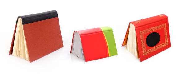 Book in colour cover with white sheets isolated on a white background