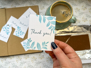 cup of coffee and card in rustic style