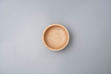 small wooden cup placed on a white background food container