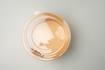 Brown paper cup with plastic lid on white background. Isolate.